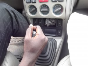: Press down the clutch pedal before putting the car on first gear or to change from one gear to another