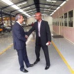 Kia MD, with Femi Owoeye at the entrance of the Kia plant following a recent courtesy visit to the company