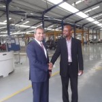 Kia MD, with Femi Owoeye at the entrance of the Kia plant following a recent courtesy visit to the company-2