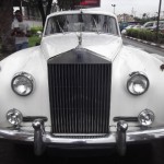 A vintage Rolls Royce being positioned by on LTV ground as a side attraction, especially for petrolheads