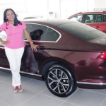 Chidi posing by her choiced car, the all-new Passat JPG