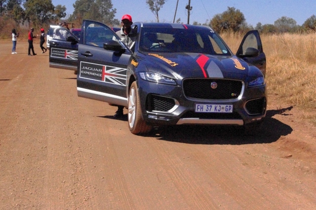 With other Motoring journalists, Femi Owoeye alighting from the F-Pace he test-drove along a rough terrain in South Africa